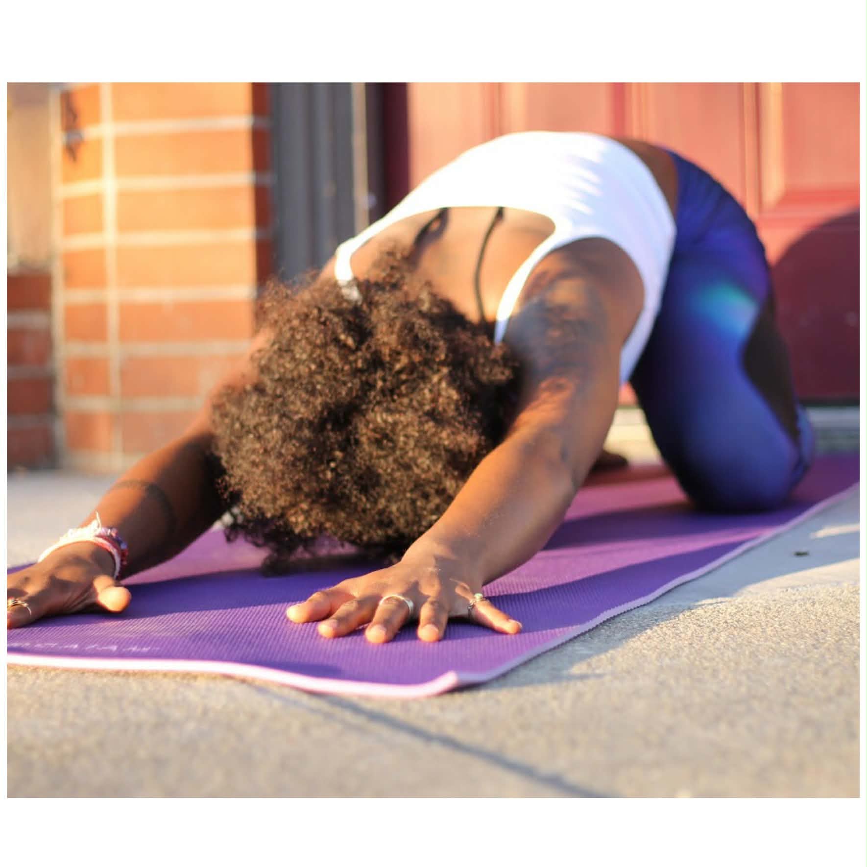 Go Stretch Factory guide in a restorative stretch outdoors